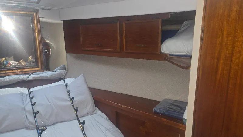 Slide: The Image of Luxurious interior of 1984 Ocean Yachts 46 Super Sport with beige sofa and TV. - 20