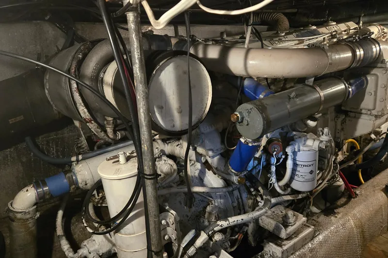 Slide: The Image of Engine room of a 1984 Ocean Yachts 46 Super Sport, showcasing mechanical components. - 39