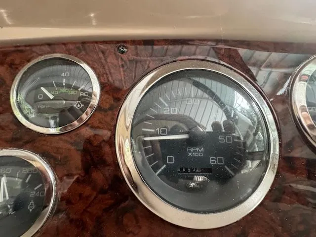 Slide: The Image of Dashboard gauges of a 1999 Sea Ray 38' Sundancer boat. - 13