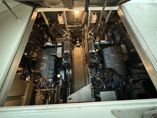 Slide: The Image of Engine room of a 1999 Sea Ray 38' Sundancer with twin engines. - 23