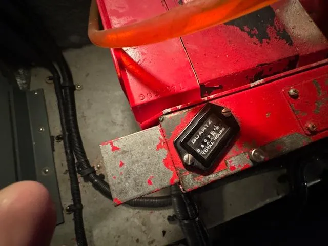 Slide: The Image of Engine compartment of 1999 Sea Ray 38' Sundancer with red machinery and wiring. - 25