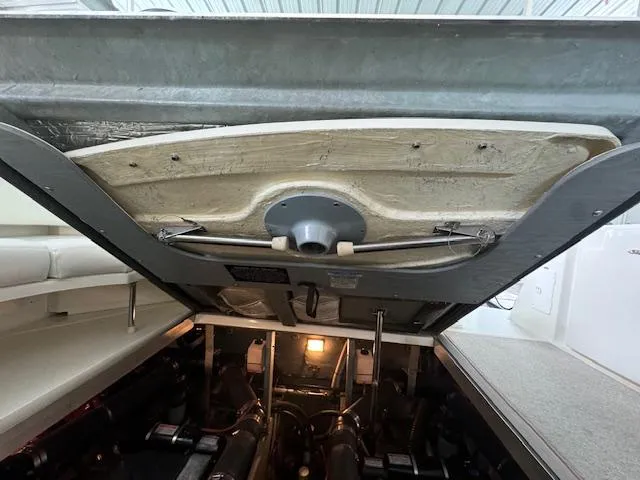 Slide: The Image of Engine compartment of a 1999 Sea Ray 38' Sundancer boat, showing mechanical components. - 28