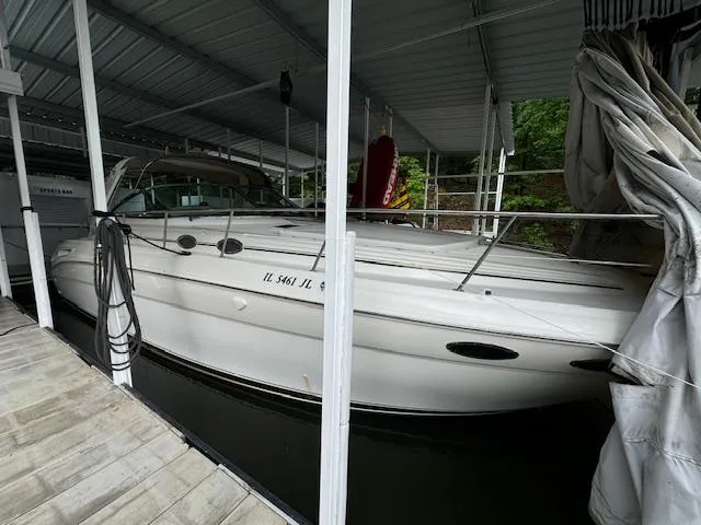Slide: The Image of 1999 Sea Ray 38' Sundancer docked under a covered marina. - 3
