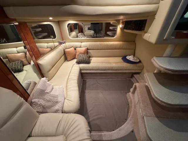 Slide: The Image of Luxurious interior of a 1999 Sea Ray 38' Sundancer yacht with plush seating. - 32