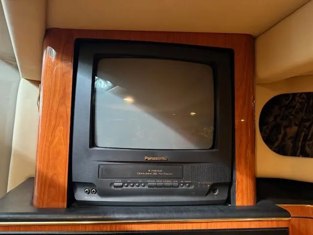 Slide: The Image of 1999 Sea Ray 38' Sundancer interior with vintage Panasonic TV. - 40