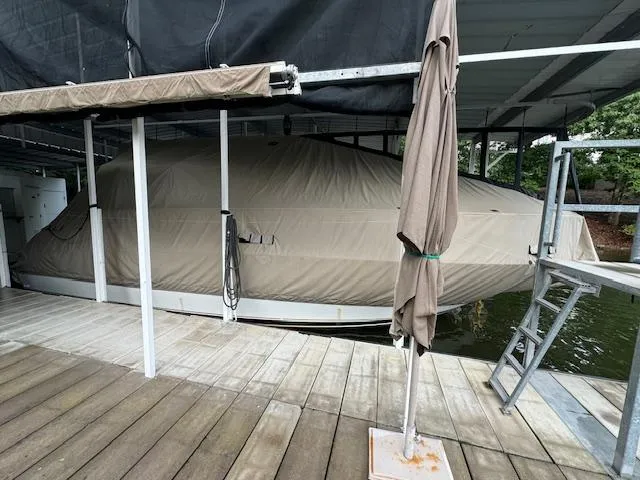 Slide: The Image of Covered 1999 Sea Ray 38' Sundancer docked under shelter. - 48