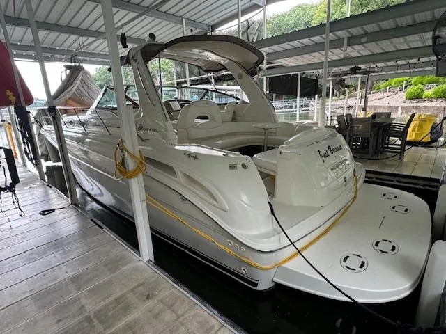 Slide: The Image of 1999 Sea Ray 38' Sundancer docked in a covered marina. - 5