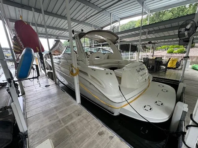 Slide: The Image of 1999 Sea Ray 38' Sundancer docked in a covered marina slip. - 6