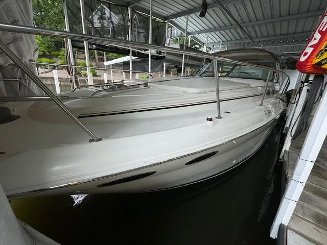 Slide: The Image of 1999 Sea Ray 38' Sundancer docked under a covered marina. - 7