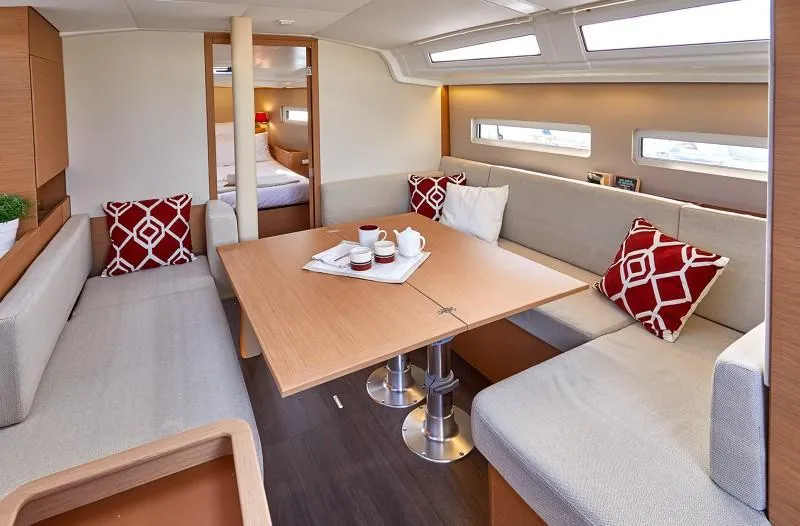 Slide: The Image of Interior of 2026 Jeanneau Sun Odyssey 410 yacht with cozy seating and modern design. - 7