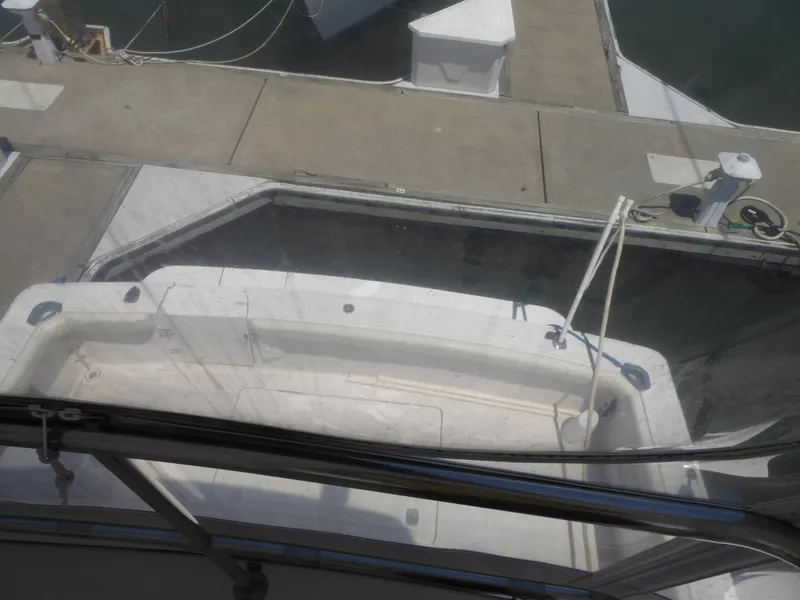 Slide: The Image of View of a 2000 Silverton 42C Cummins 450 Diesels yacht docked at a marina. - 11