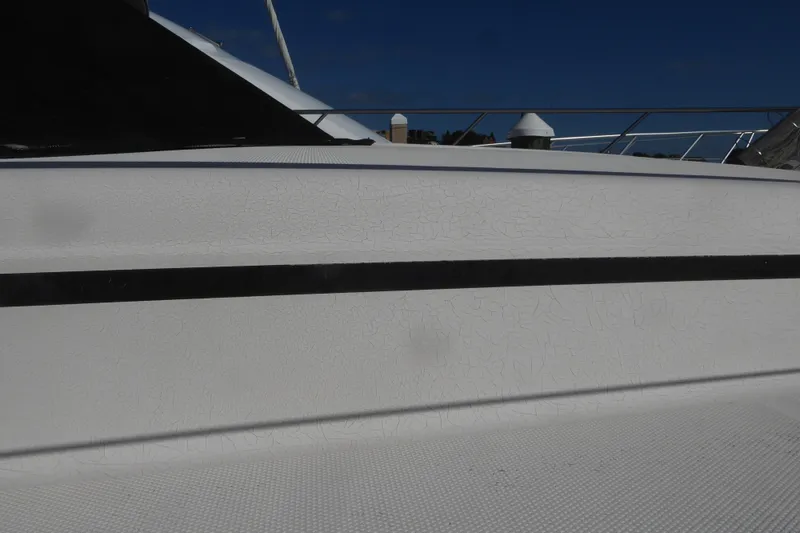 Slide: The Image of Side view of a 2000 Silverton 42C Cummins 450 Diesels boat. - 14