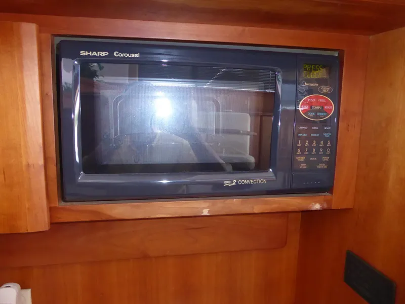 Slide: The Image of Sharp Carousel microwave in a 2000 Silverton 42C Cummins yacht kitchen. - 27