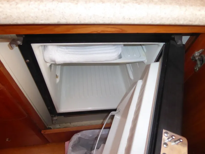 Slide: The Image of Open mini fridge in a 2000 Silverton 42C Cummins 450 Diesels boat. - 28