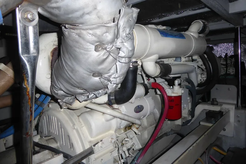 Slide: The Image of Engine compartment of 2000 Silverton 42C with Cummins 450 Diesels, showing detailed components. - 41