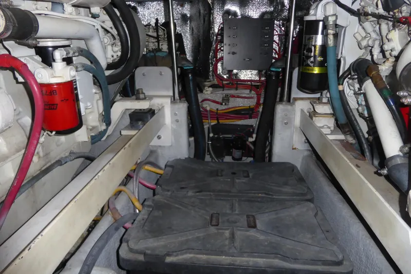 Slide: The Image of Engine room of 2000 Silverton 42C with Cummins 450 Diesels, showing components and wiring. - 42