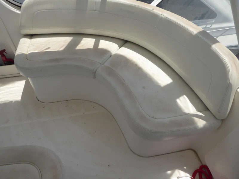 Slide: The Image of White curved seating on a 2000 Silverton 42C Cummins yacht. - 7