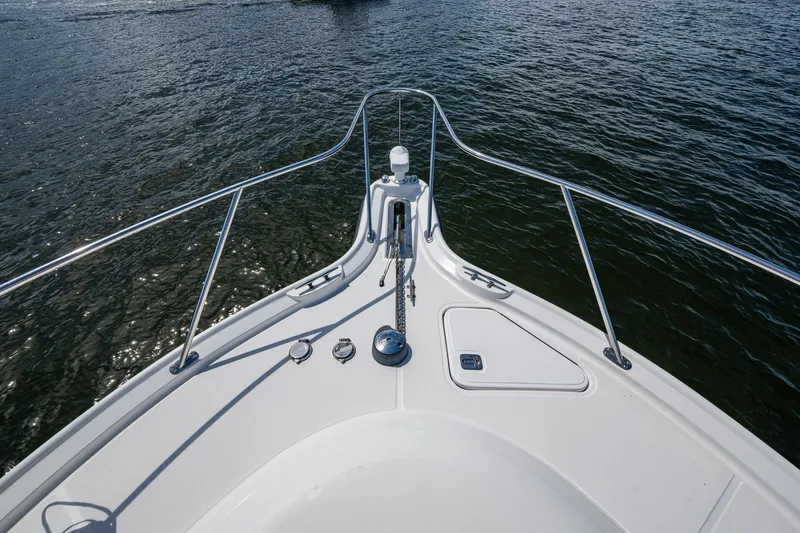 Slide: The Image of Bow view of 2008 Tiara Yachts 3200 Open on water, featuring sleek railings. - 11