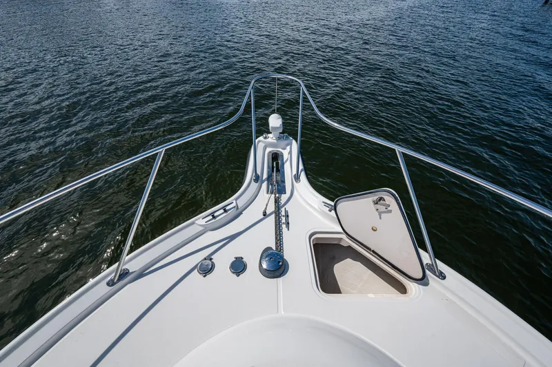 Slide: The Image of Bow view of 2008 Tiara Yachts 3200 Open on water, featuring anchor hatch. - 12