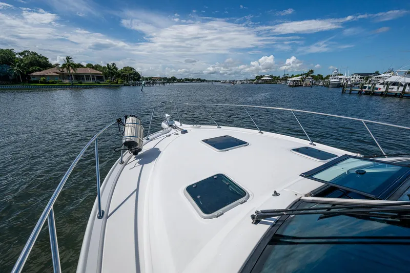 Slide: The Image of 2008 Tiara Yachts 3200 Open cruising on a sunny day with scenic waterfront views. - 14