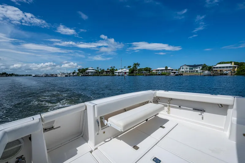 Slide: The Image of 2008 Tiara Yachts 3200 Open on calm waters with scenic coastal view. - 17
