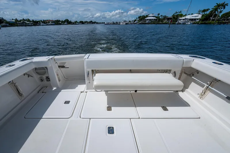 Slide: The Image of 2008 Tiara Yachts 3200 Open boat deck with seating, cruising on a sunny day. - 18