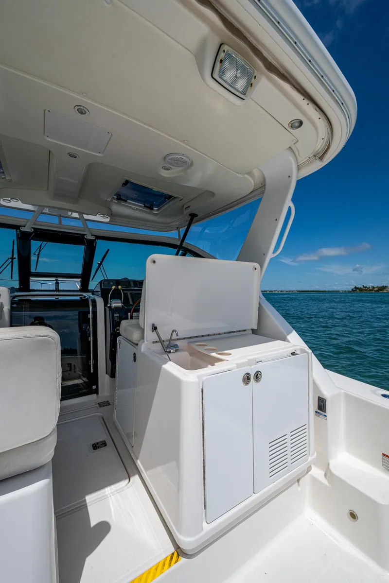 Slide: The Image of 2008 Tiara Yachts 3200 Open interior, featuring sleek design and ocean view. - 25