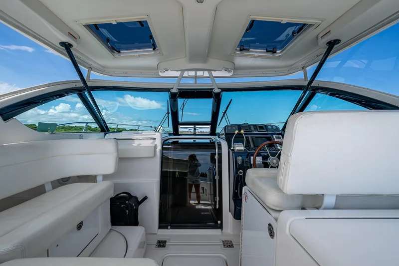 Slide: The Image of Interior view of 2008 Tiara Yachts 3200 Open, featuring helm and seating area. - 26