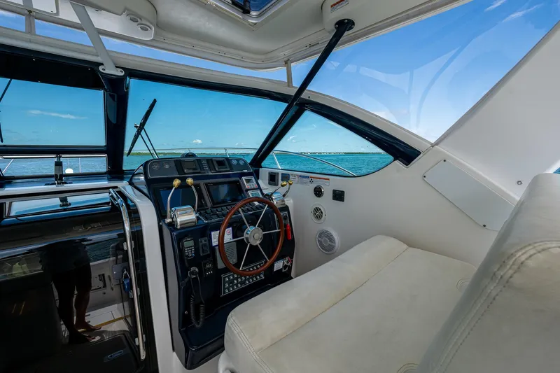 Slide: The Image of 2008 Tiara Yachts 3200 Open helm with ocean view through windshield. - 27