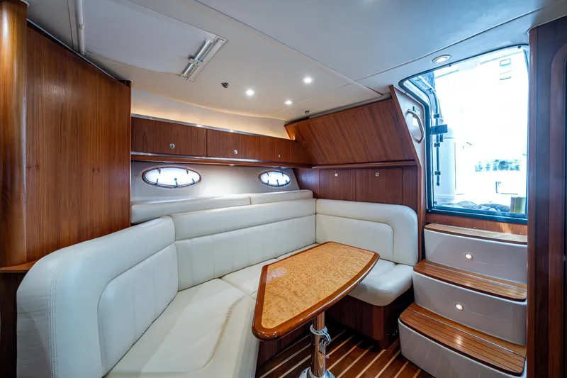 Slide: The Image of Luxurious interior of 2008 Tiara Yachts 3200 Open with elegant wood and leather seating. - 35