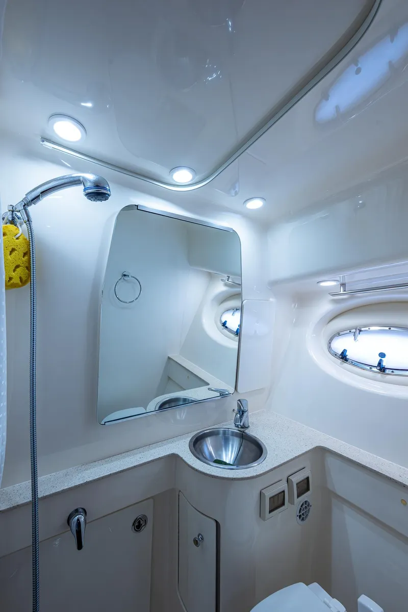 Slide: The Image of 2008 Tiara Yachts 3200 Open bathroom with sink, mirror, and showerhead. - 40