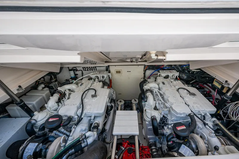 Slide: The Image of Engine compartment of a 2008 Tiara Yachts 3200 Open, showcasing dual engines and mechanical components. - 41
