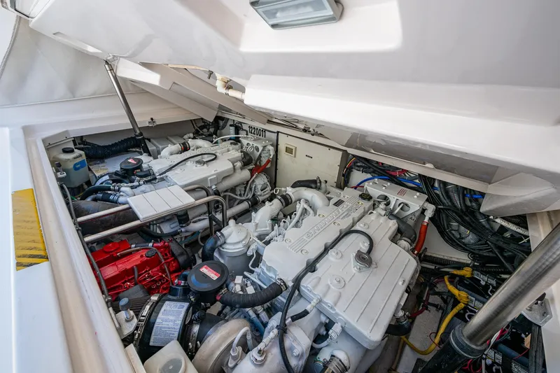Slide: The Image of Engine compartment of a 2008 Tiara Yachts 3200 Open, showcasing dual engines and wiring. - 43