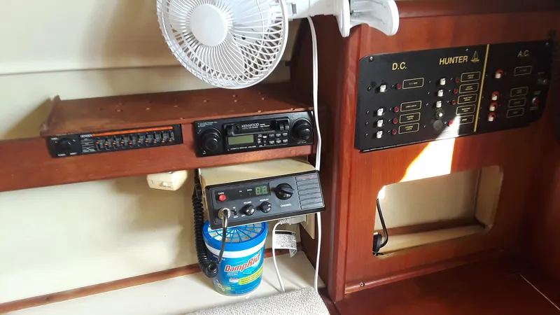 Slide: The Image of Electrical panel and radio equipment inside a 1990 Hunter 28 sailboat cabin. - 15