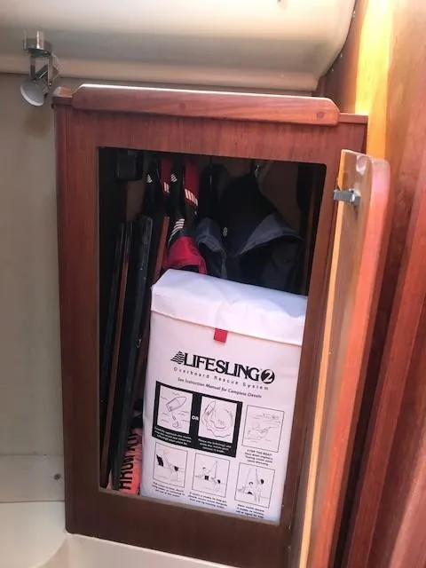 Slide: The Image of Cabinet in 1990 Hunter 28 sailboat with Lifesling2 safety equipment. - 18