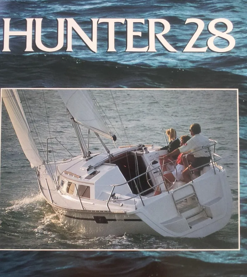 Slide: The Image of 1990 Hunter 28 sailboat navigating ocean waters with two people onboard. - 6