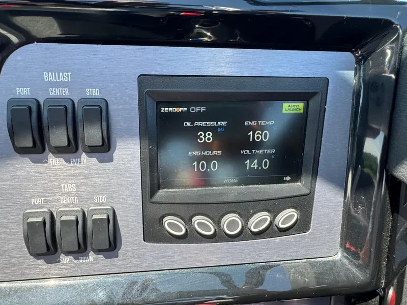 Slide: The Image of Control panel of a 2022 MasterCraft NXT22 boat displaying engine metrics. - 16