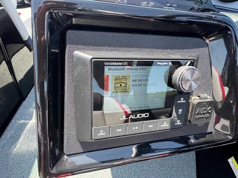 Slide: The Image of Dashboard of 2022 MasterCraft NXT22 with JL Audio system displaying Bluetooth connection. - 17