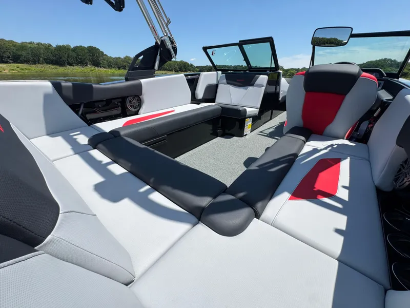 Slide: The Image of 2022 MasterCraft NXT22 boat interior with spacious seating and modern design. - 26