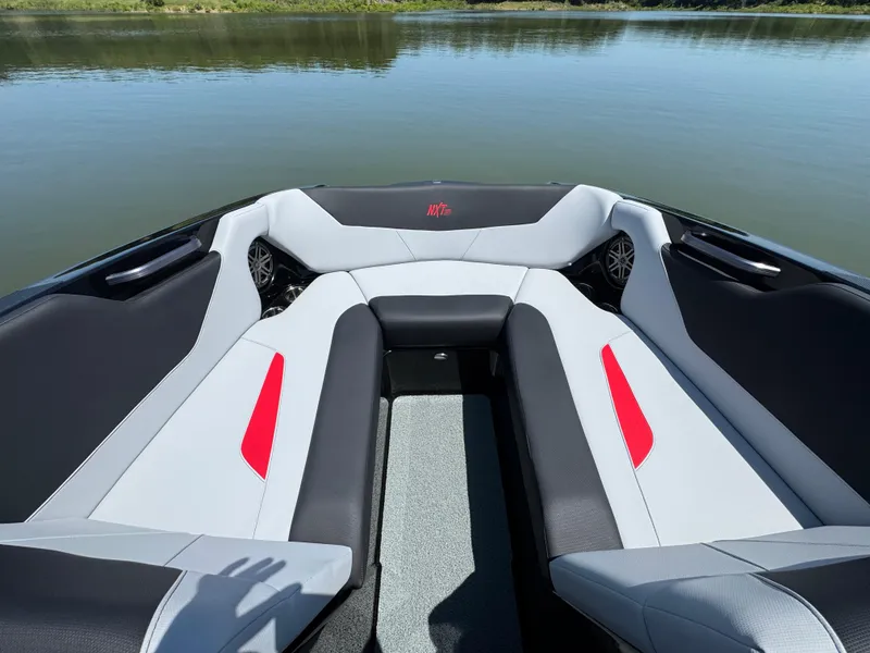 Slide: The Image of Interior of 2022 MasterCraft NXT22 boat with stylish seating and lake view. - 9