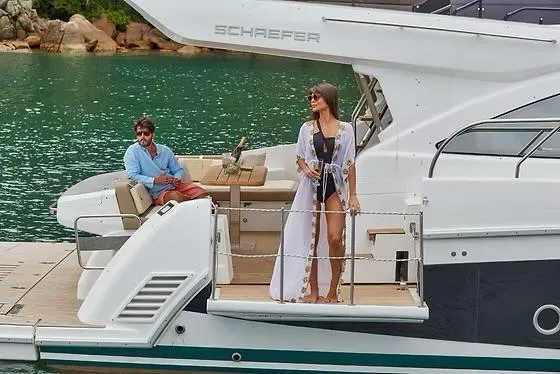Slide: The Image of Couple enjoying a luxurious day on a 2026 Schaefer 510 GT Pininfarina yacht. - 12