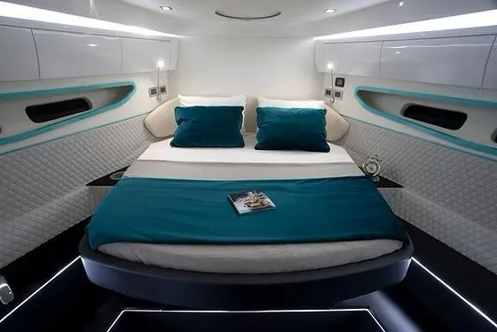 Slide: The Image of Luxurious interior of 2026 Schaefer 510 GT Pininfarina yacht with modern bedding and ambient lighting. - 29