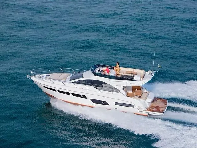 Slide: The Image of 2026 Schaefer 510 GT Pininfarina yacht cruising on open sea, showcasing sleek design and luxury. - 5