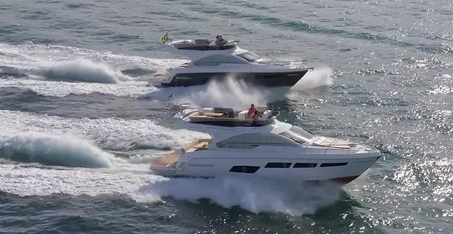 Slide: The Image of Two Schaefer 510 GT Pininfarina yachts cruising on the ocean, 2026 model. - 6