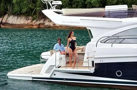 Slide: The Image of Luxury Schaefer 510 GT Pininfarina yacht cruising on serene waters, 2026 model. - 7