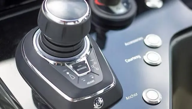 Slide: The Image of Control panel of 2025 Schaefer V33 yacht with joystick and buttons. - 10