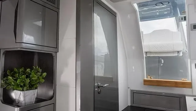 Slide: The Image of Interior of 2025 Schaefer V33 yacht with modern design and potted plant. - 21