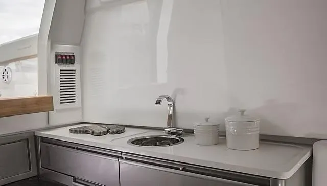 Slide: The Image of Modern kitchen area on 2025 Schaefer V33 yacht with sleek countertop and sink. - 22