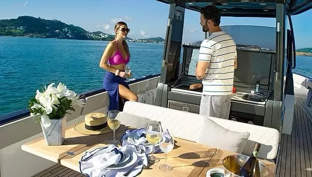 Slide: The Image of Couple enjoying leisure time on a 2025 Schaefer V33 yacht, with scenic ocean views. - 33