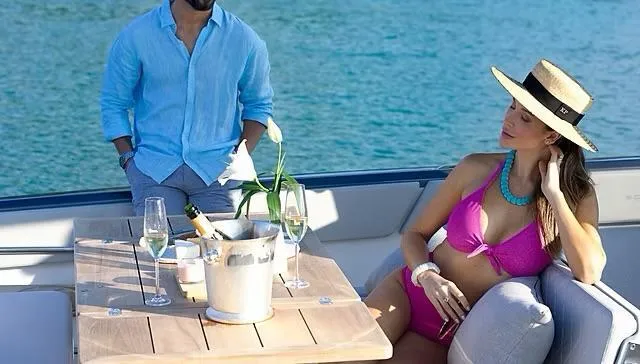 Slide: The Image of Couple relaxing on Schaefer V33 yacht, enjoying drinks, 2025 model. - 34